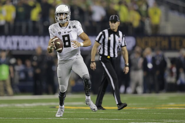 Oregon quarterback Marcus Mariota (8) looks to throw during the first half of the NCAA college football playoff championship game against Ohio State Monday, Jan. 12, 2015, in Arlington, Texas. (AP Photo/Eric Gay) Oregon quarterback Marcus Mariota (8) looks to throw during the first half of the NCAA college football playoff championship game against Ohio State Monday, Jan. 12, 2015, in Arlington, Texas. (AP Photo/Eric Gay)