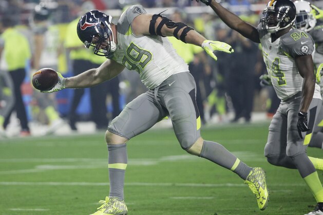 Houston Texans' J.J. Watt (99) celebrates after recovering a fumble during the second half of the NFL Football Pro Bowl Sunday, Jan. 25, 2015, in Glendale, Ariz. (AP Photo/David J. Phillip)