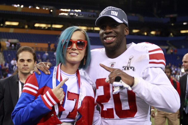 New York Giants defensive back Prince Amukamara (20) celebrates with pop star Katy Perry after the Giants' 21-17 win in the NFL Super Bowl XLVI football game against the New England Patriots  Sunday, Feb. 5, 2012, in Indianapolis. (AP Photo/Jeff Roberson)