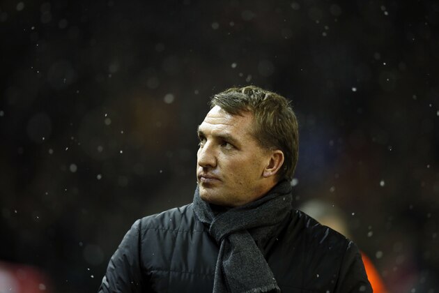 Liverpool's head coach Brendan Rodgers takes to the touchline before the English League Cup semi-final first leg soccer match between Liverpool and Chelsea at Anfield Stadium, Liverpool, England, Tuesday Jan. 20, 2015. (AP Photo/Jon Super)