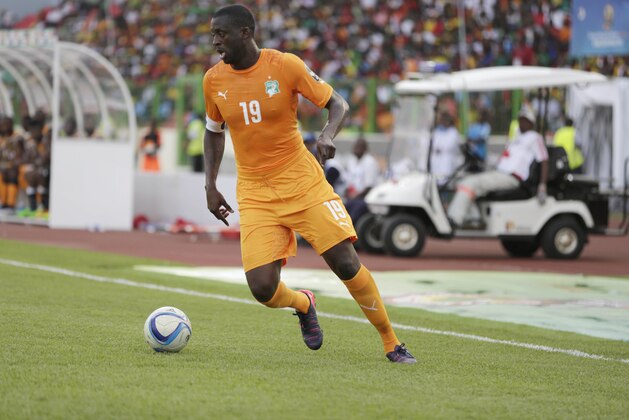 Ivory Coast's Yaya Toure controls the ball during their African Cup of Nations Group D soccer match against Guinea in Estadio De Malabo, Equatorial Guinea, Tuesday Jan. 20, 2015. (AP Photo/Sunday Alamba)