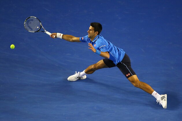 MELBOURNE, AUSTRALIA - JANUARY 26:  Novak Djokovic of Serbia plays a forehand in his fourth round match against Gilles Muller of Luxembourg during day eight of the 2015 Australian Open at Melbourne Park on January 26, 2015 in Melbourne, Australia  (Photo by Quinn Rooney/Getty Images)