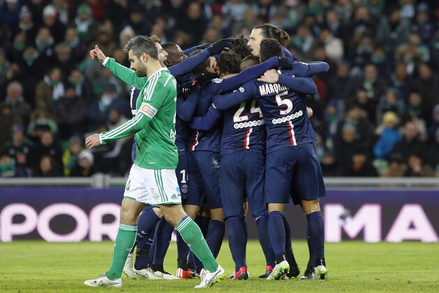 Paris Saint Germain's Zlatan Ibrahimovic, right, celebrates with his teammates after he scored a goal against Saint-Etienne during their French League One soccer match in Saint-Etienne, central France, Sunday, Jan. 25, 2015. (AP Photo/Laurent Cipriani)