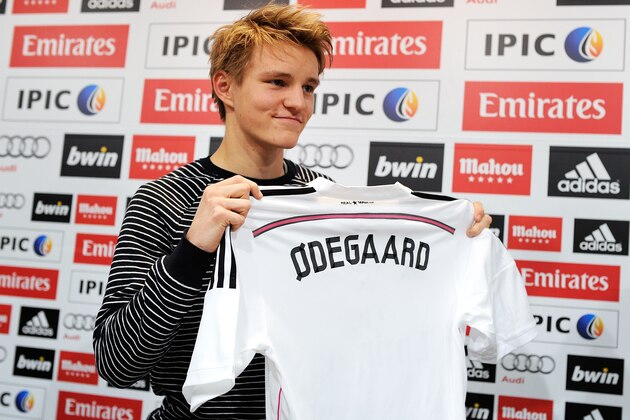 MADRID, SPAIN - JANUARY 22:  Martin Odegaard from Norway holds his new Real Madrid shirt during a press conference at Real Madrid's Valdebebas training grounds after he signed with Real on January 22, 2015 in Madrid, Spain. Odegaard aged 16 will play for Real's second team Real Madrid Castilla and had been linked with many of Europe's top clubs.  (Photo by Denis Doyle/Getty Images)