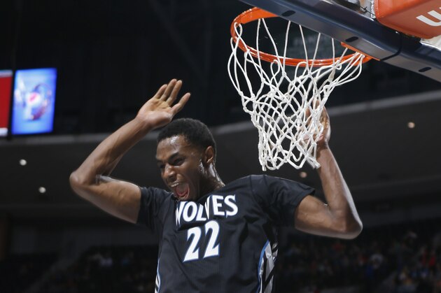 Minnesota Timberwolves forward Andrew Wiggins reacts after missing a pass for potential dunk against the Denver Nuggets in the first quarter of an NBA basketball game Saturday, Jan. 17, 2015, in Denver. (AP Photo/David Zalubowski)