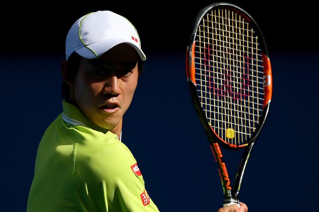 MELBOURNE, AUSTRALIA - JANUARY 26:  Kei Nishikori of Japan plays a backhand in his fourth round match against David Ferrer of Spain during day eight of the 2015 Australian Open at Melbourne Park on January 26, 2015 in Melbourne, Australia.  (Photo by Clive Brunskill/Getty Images)