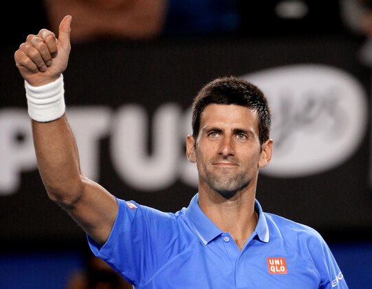 Novak Djokovic of Serbia celebrates after defeating Gilles Muller of Luxembourg in their fourth round match at the Australian Open tennis championship in Melbourne, Australia, Tuesday, Jan. 27, 2015. (AP Photo/Rob Griffith)