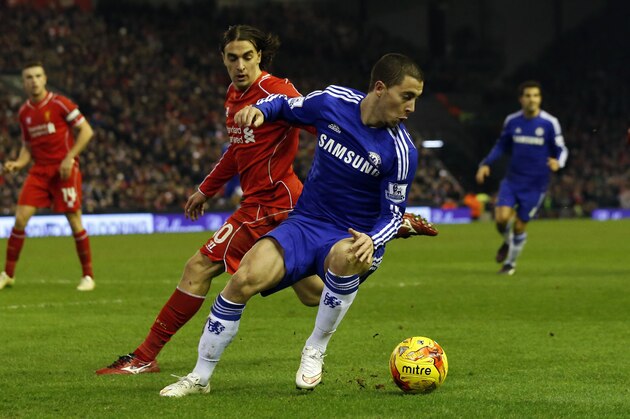 Chelsea's Eden Hazard, right, competes for the ball with Liverpool's Lazar Markovic during the English League Cup semi-final first leg soccer match between Liverpool and Chelsea at Anfield Stadium, Liverpool, England, Tuesday Jan. 20, 2015. (AP Photo/Jon Super)
