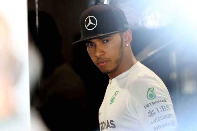 SUZUKA, JAPAN - OCTOBER 03:  Lewis Hamilton of Great Britain and Mercedes GP looks on from the team garage during practice for the Japanese Formula One Grand Prix at Suzuka Circuit on October 3, 2014 in Suzuka, Japan.  (Photo by Clive Mason/Getty Images)