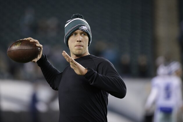 Philadelphia Eagles' Nick Foles warms up before an NFL football game against the Dallas Cowboys, Sunday, Dec. 14, 2014, in Philadelphia. (AP Photo/Michael Perez)