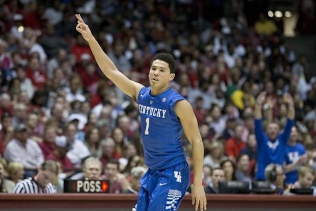 Kentucky guard Devin Booker (1) celebrates after scoring during the second half of an NCAA college basketball game against Alabama, Saturday, Jan. 17, 2015, in Tuscaloosa, Ala. Kentucky won 70-48. (AP Photo/Brynn Anderson)