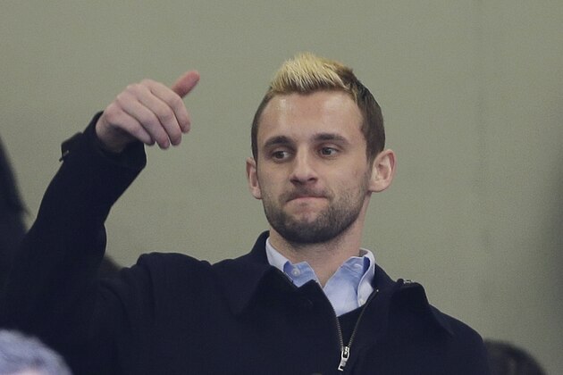 Inter Milan new player Marcelo Brozovic gives the thumb-up sign prior to a Serie A soccer match between Inter Milan and Torino, at the San Siro stadium in Milan, Italy, Sunday, Jan.25, 2015. (AP Photo/Luca Bruno)