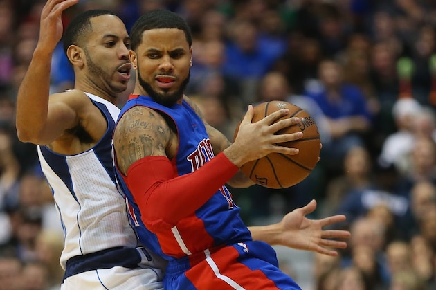 DALLAS, TX - JANUARY 07:  D.J. Augustin #14 of the Detroit Pistons dribbles the ball against Devin Harris #20 of the Dallas Mavericks at American Airlines Center on January 7, 2015 in Dallas, Texas.   NOTE TO USER: User expressly acknowledges and agrees that, by downloading and or using this photograph, User is consenting to the terms and conditions of the Getty Images License Agreement.  (Photo by Ronald Martinez/Getty Images)