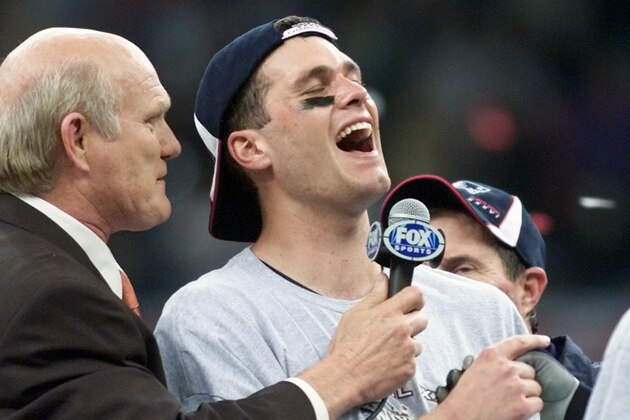 New England Patriots quarterback Tom Brady talks with Terry Bradshaw, left, after being name MVP of the Super Bowl, Sunday, Feb. 3, 2002, in New Orleans. The Patriots beat the St. Louis Rams 20-17. (AP Photo/Michael Conroy)