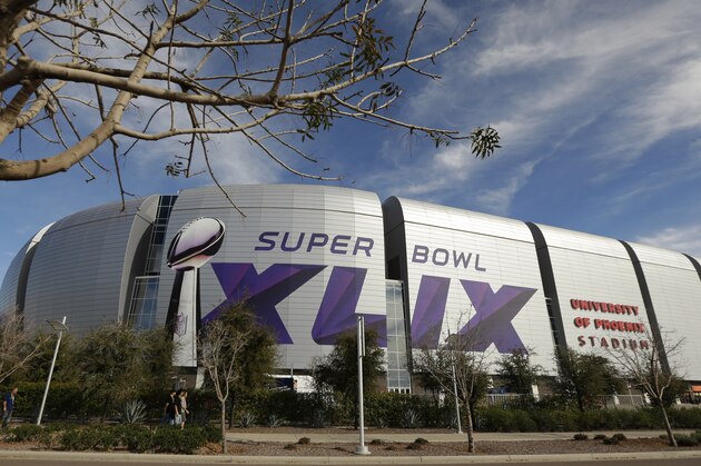 The Super Bowl XLIX logo is displayed on the University of Phoenix Stadium before the Pro Bowl Sunday, Jan. 25, 2015, in Glendale, Ariz. The venue will also host Super Bowl XLIX between the New England Patriots and the Seattle Seahawks on Sunday, Feb. 1, 2015. (AP Photo/Charlie Riedel)