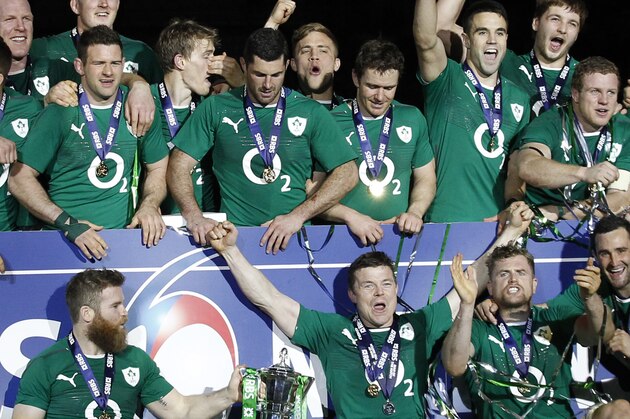 Ireland's rugby team players celebrate after defeating France and winning the Six Nations Rugby Union tournament at the stade de France stadium, in Saint Denis, outside Paris, Saturday, March 15, 2014. (AP Photo/Christophe Ena)