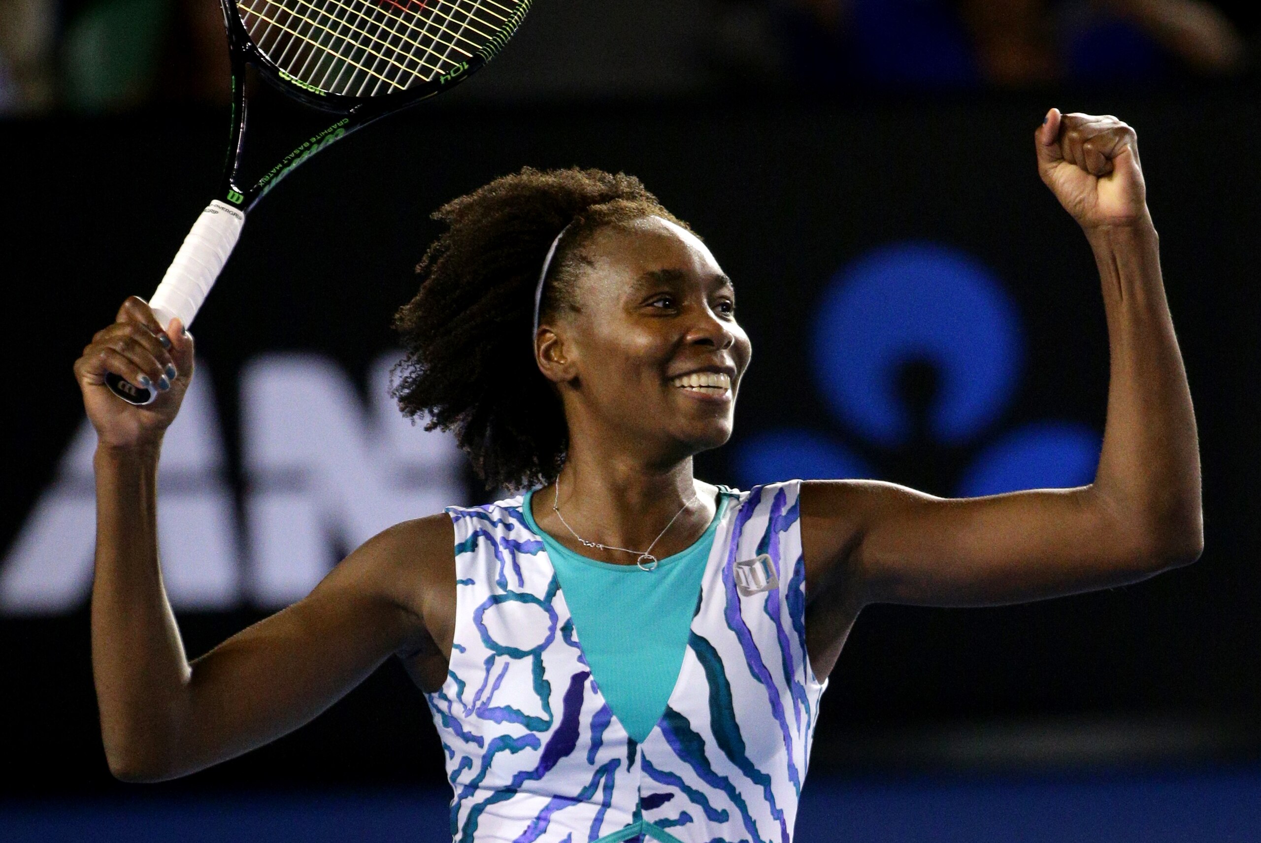 Venus Williams of the U.S. celebrates after winning over Agnieszka Radwanska of Poland in their fourth round match at the Australian Open tennis championship in Melbourne, Australia, Monday, Jan. 26, 2015. (AP Photo/Rob Griffith)