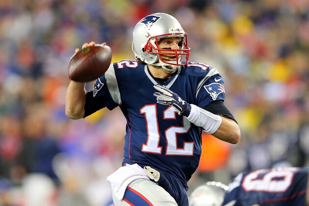 FOXBORO, MA - JANUARY 18:  Tom Brady #12 of the New England Patriots in action against the Indianapolis Colts of the 2015 AFC Championship Game at Gillette Stadium on January 18, 2015 in Foxboro, Massachusetts.  (Photo by Elsa/Getty Images)
