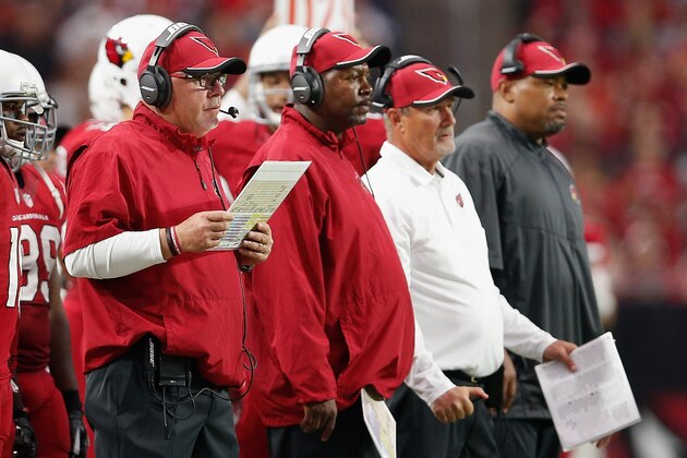 GLENDALE, AZ - DECEMBER 07:  (L-R) Head coach Bruce Arians, defensive coordinator Todd Bowles, strength and conditioning coach Buddy Morris and offensive coordinator Harold Goodwin of the Arizona Cardinals on the sidelines during the NFL game against the Kansas City Chiefs at the University of Phoenix Stadium on December 7, 2014 in Glendale, Arizona.  The Cardinals defeated the Chiefs 17-14.  (Photo by Christian Petersen/Getty Images)