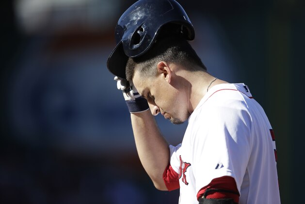 Boston Red Sox's Allen Craig removes his helmet after grounding out to second in the sixth inning of a baseball game against the Toronto Blue Jays, Sunday, Sept. 7, 2014, in Boston. (AP Photo/Steven Senne)