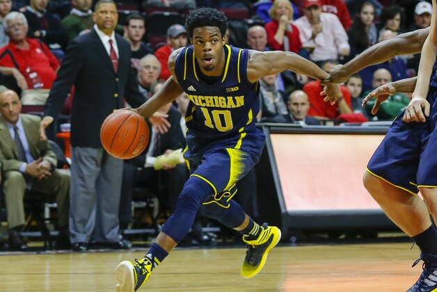 Jan 20, 2015; Piscataway, NJ, USA;  Michigan Wolverines guard Derrick Walton Jr. (10) drives to the basket during the first half against the Rutgers Scarlet Knights at the Louis Brown Athletic Center. Mandatory Credit: Jim O'Connor-USA TODAY Sports