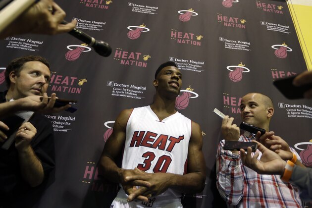 Miami Heat guard Norris Cole is interviewed during NBA basketball media day, Friday, Sept. 26, 2014, in Miami. (AP Photo/Lynne Sladky)
