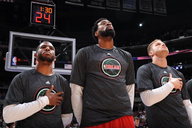 LOS ANGELES, CA - JANUARY 19:  Chris Paul #3, DeAndre Jordan #6 and Blake Griffin #32 of the Los Angeles Clippers during the national anthem before the game against the Boston Celtics on January 19, 2015 at STAPLES Center in Los Angeles, California. NOTE TO USER: User expressly acknowledges and agrees that, by downloading and/or using this Photograph, user is consenting to the terms and conditions of the Getty Images License Agreement. Mandatory Copyright Notice: Copyright 2015 NBAE (Photo by Andrew D. Bernstein/NBAE via Getty Images)
