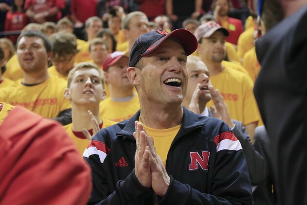 Nebraska head football coach Mike Riley stands in the student section as he attends an NCAA college basketball game between Michigan State and Nebraska in Lincoln, Neb., Saturday, Jan. 24, 2015. Nebraska won 79-77. (AP Photo/Nati Harnik)