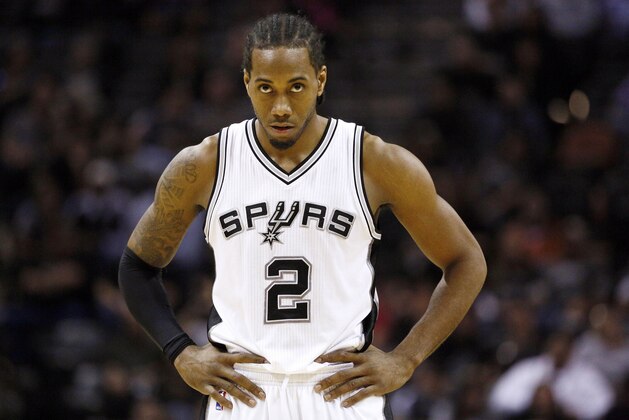 Jan 25, 2015; San Antonio, TX, USA; San Antonio Spurs small forward Kawhi Leonard (2) watches a free throw during the first half against the Milwaukee Bucks at AT&T Center. Mandatory Credit: Soobum Im-USA TODAY Sports