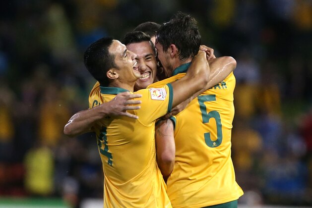 NEWCASTLE, AUSTRALIA - JANUARY 27: Tim Cahill Jason Davidson and Mark Milligan of Australia celebrate a goal during the Asian Cup Semi Final match between the Australian Socceroos and the United Arab Emirates at Hunter Stadium on January 27, 2015 in Newcastle, Australia.  (Photo by Tony Feder/Getty Images)