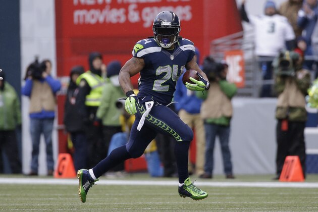 Seattle Seahawks running back Marshawn Lynch (24) runs against the Green Bay Packers during the first half of the NFL football NFC Championship game Sunday, Jan. 18, 2015, in Seattle. (AP Photo/Jeff Chiu)