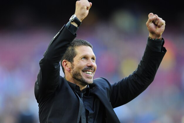 Atletico's coach Diego Simeone from Argentina celebrates winning the Spanish League title during a Spanish La Liga soccer match between FC Barcelona and Atletico Madrid at the Camp Nou stadium in Barcelona, Spain, Saturday, May 17, 2014. Atletico clinched its first league title in 18 years after a 1-1 draw. (AP Photo/Manu Fernandez)