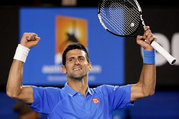 Novak Djokovic of Serbia celebrates after defeating Gilles Muller of Luxembourg in their fourth round match at the Australian Open tennis championship in Melbourne, Australia, Tuesday, Jan. 27, 2015. (AP Photo/Rob Griffith)