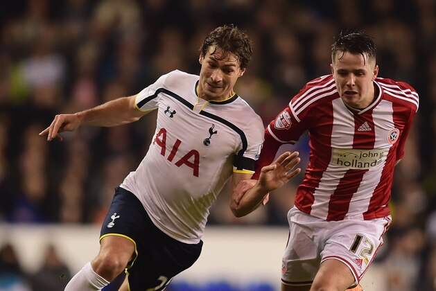 LONDON, ENGLAND - JANUARY 21:  Benjamin Stambouli of Spurs and Marc McNulty of Sheffield United battle for the ball during the Capital One Cup Semi-Final first leg match between Tottenham Hotspur and Sheffield United at White Hart Lane on January 21, 2015 in London, England.  (Photo by Jamie McDonald/Getty Images)