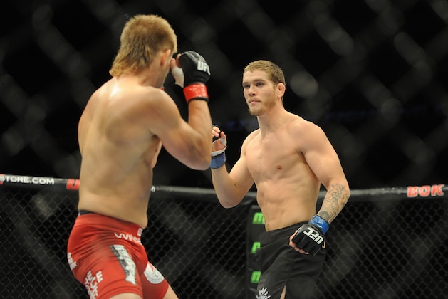 Aug 23, 2014; Tulsa, OK, USA; Mike Pyle (red gloves) fights Jordan Mein (blue gloves) in a Welterweight Bout at BOK Center. Mandatory Credit: Mark D. Smith-USA TODAY Sports