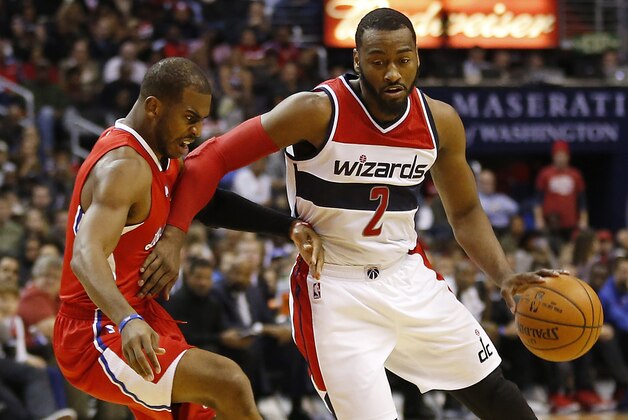 Dec 12, 2014; Washington, DC, USA; Washington Wizards guard John Wall (2) dribbles the ball as Los Angeles Clippers guard Chris Paul (3) defends in the second quarter at Verizon Center. Mandatory Credit: Geoff Burke-USA TODAY Sports