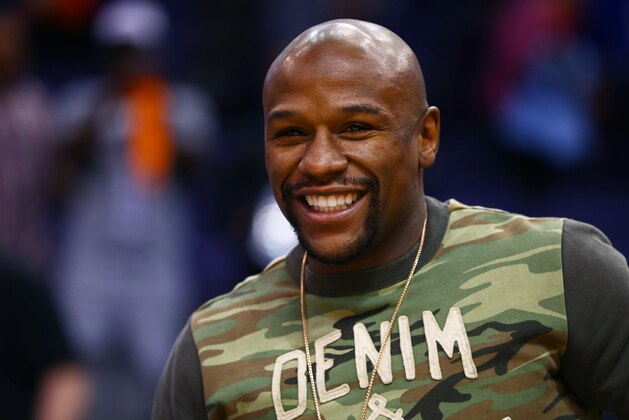Jan 19, 2015; Phoenix, AZ, USA; Professional boxer Floyd Mayweather Jr following the game between the Phoenix Suns against the Los Angeles Lakers at US Airways Center. Mandatory Credit: Mark J. Rebilas-USA TODAY Sports