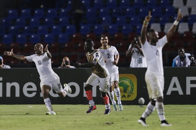 Ghana's Andre Ayew, left, celebrates with teammates after scoring a goal during their African Cup of Nations Group C soccer match in Mongomo, Equatorial Guinea, Tuesday, Jan. 27, 2015. (AP Photo/Themba Hadebe)