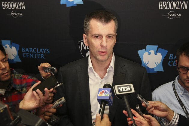 FILE - In this Nov. 3, 2014, file photo, Brooklyn Nets owner Mikhail Prokhorov speaks to the media during a news conference before an NBA basketball game between the Nets and the Oklahoma City Thunder at the Barclays Center in New York. Prokhorov is still open to offers for the Nets, but a spokesperson for the Russian billionaire said Tuesday, Jan. 13, 2015,  no sale is imminent. (AP Photo/John Minchillo, File)