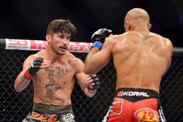 Aug 3, 2013; Rio De Janeiro, Brazil; Ian McCall (red gloves) and Iliarde Santos fight during UFC 163 at HSBC Arena. Mandatory Credit: Jason Silva-USA TODAY Sports