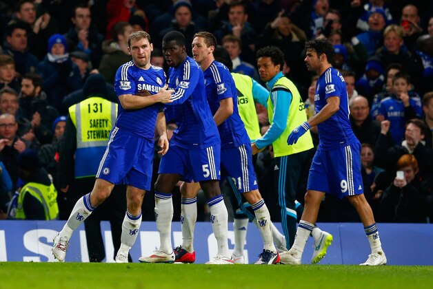 LONDON, ENGLAND - JANUARY 27:  Branislav Ivanovic of Chelsea celebrates scoring their first goal with Kurt Zouma of Chelsea  in extra time during the Capital One Cup Semi-Final second leg between Chelsea and Liverpool at Stamford Bridge on January 27, 2015 in London, England.  (Photo by Julian Finney/Getty Images)