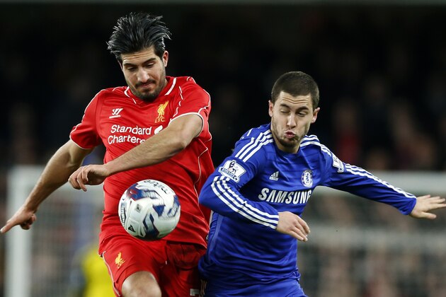 Liverpool's Emre Can, left, battles for the ball with Chelsea's Eden Hazard during the English League Cup semifinal second leg soccer match between Chelsea and Liverpool at Stamford Bridge stadium in London, Tuesday, Jan. 27, 2015. (AP Photo/Alastair Grant)