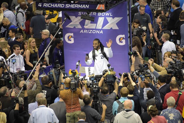 Jan 27, 2015; Phoenix, AZ, USA; Seattle Seahawks cornerback Richard Sherman waves to members of the press during media day for Super Bowl XLIX at US Airways Center. Mandatory Credit: Kirby Lee-USA TODAY Sports