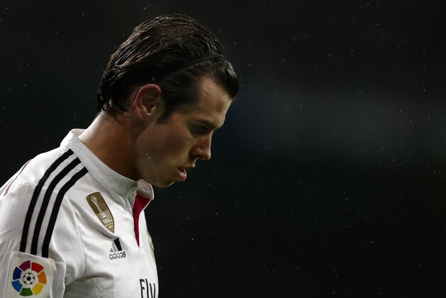 Real Madrid's Gareth Bale from Britain reacts during a King's Cup soccer match between Atletico de Madrid and Real Madrid a at the Santiago Bernabeu stadium in Madrid, Spain, Thursday, Jan. 15, 2015. (AP Photo/Daniel Ochoa de Olza)
