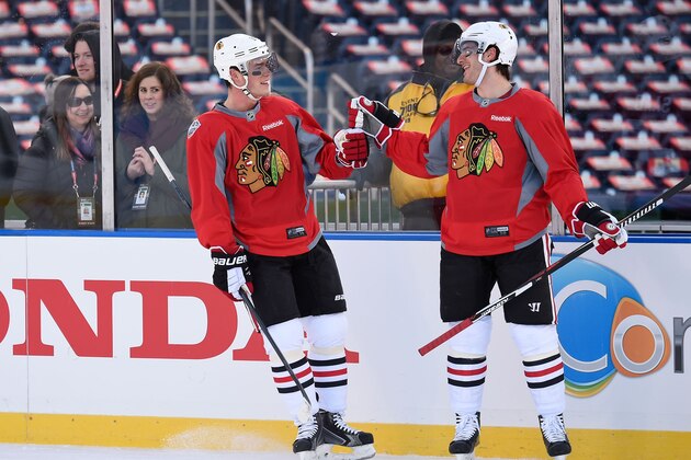 WASHINGTON, DC - DECEMBER 31:  Jonathan Toews #19 and Brandon Saad #20 of the Chicago Blackhawks skate during practice day prior to the 2015 Bridgestone NHL Winter Classic on December 31, 2014 in Washington, D.C.  The 2015 Bridgestone NHL Winter Classic will take place on New Year's Day with the Washington Capitals playing the Chicago Blackhawks.  (Photo by Brian Babineau/NHLI via Getty Images)