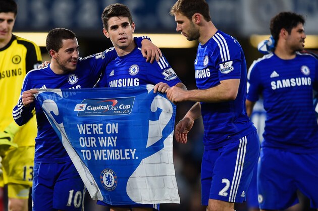 LONDON, ENGLAND - JANUARY 27:  Eden Hazard, Oscar and Branislav Ivanovic of Chelsea celebrate victory in the Capital One Cup Semi-Final second leg between Chelsea and Liverpool at Stamford Bridge on January 27, 2015 in London, England.  (Photo by Mike Hewitt/Getty Images)