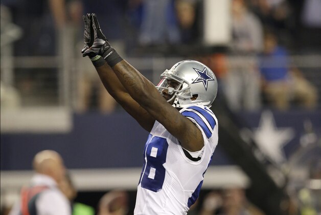 Dallas Cowboys wide receiver Dez Bryant (88) celebrates his touchdown catch against the Indianapolis Colts during the first half of an NFL football game, Sunday, Dec. 21, 2014, in Arlington, Texas. (AP Photo/Tim Sharp)