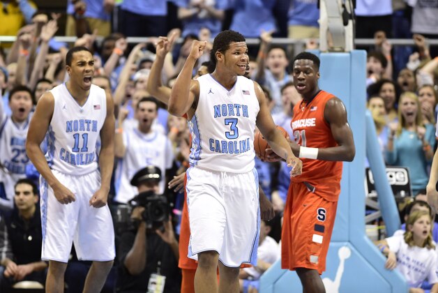 Jan 26, 2015; Chapel Hill, NC, USA; North Carolina Tar Heels forward Kennedy Meeks (3) and forward Brice Johnson (11) react as Syracuse Orange forward Tyler Roberson (21) looks on in the second half. The Tar Heels defeated the Orange 93-83 at Dean E. Smith Center. Mandatory Credit: Bob Donnan-USA TODAY Sports