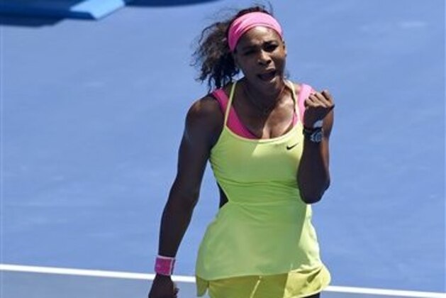 Serena Williams of the U.S. celebrates a point won against Dominika Cibulkova of Slovakia during their quarterfinal match at the Australian Open tennis championship in Melbourne, Australia, Wednesday, Jan. 28, 2015. (AP Photo/Andy Brownbill)