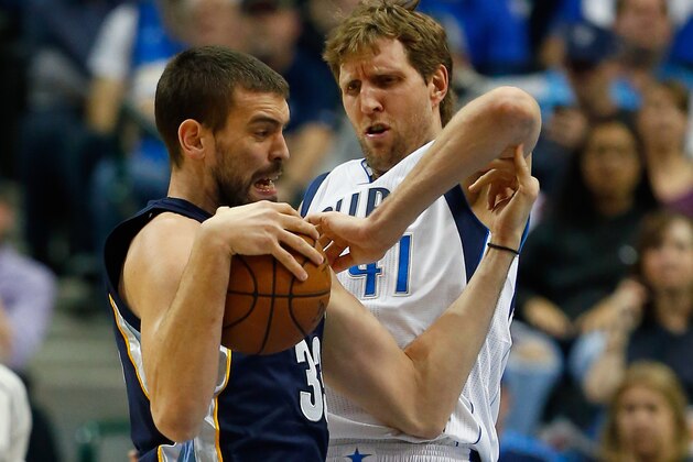 DALLAS, TX - JANUARY 27:  Marc Gasol #33 of the Memphis Grizzlies drives to the basket against Dirk Nowitzki #41 of the Dallas Mavericks in the first half at American Airlines Center on January 27, 2015 in Dallas, Texas. NOTE TO USER: User expressly acknowledges and agrees that, by downloading and or using this photograph, User is consenting to the terms and conditions of the Getty Images License Agreement.  (Photo by Tom Pennington/Getty Images)